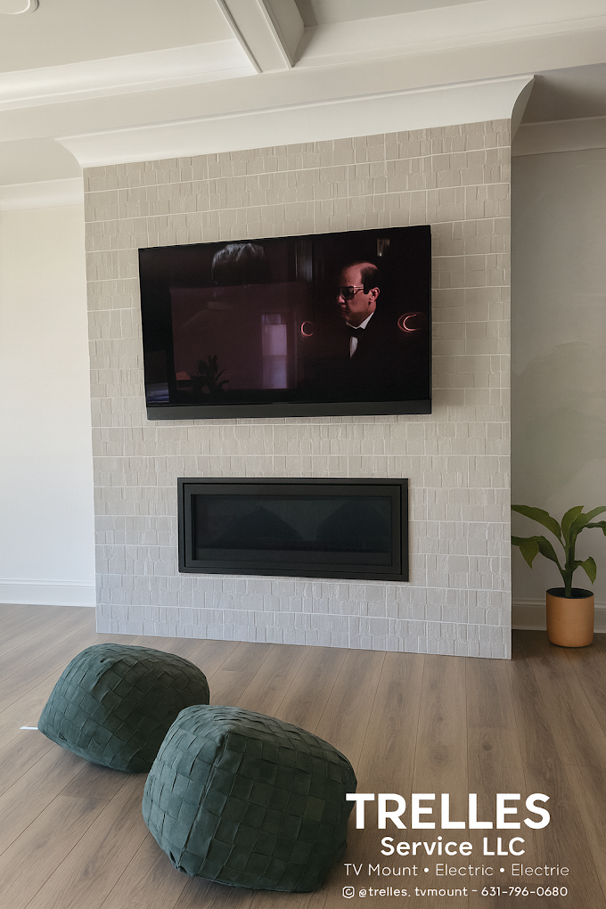 TV mounted above fireplace with clean wire concealment