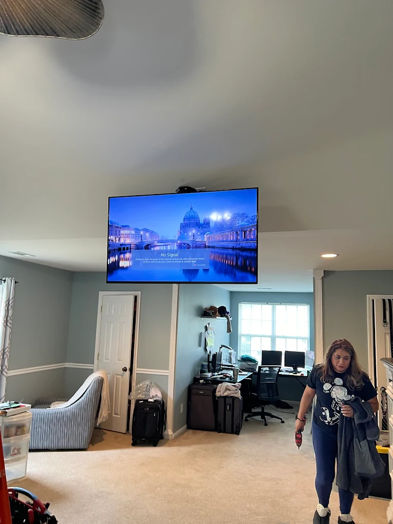 Ceiling-mounted TV installation in bonus room